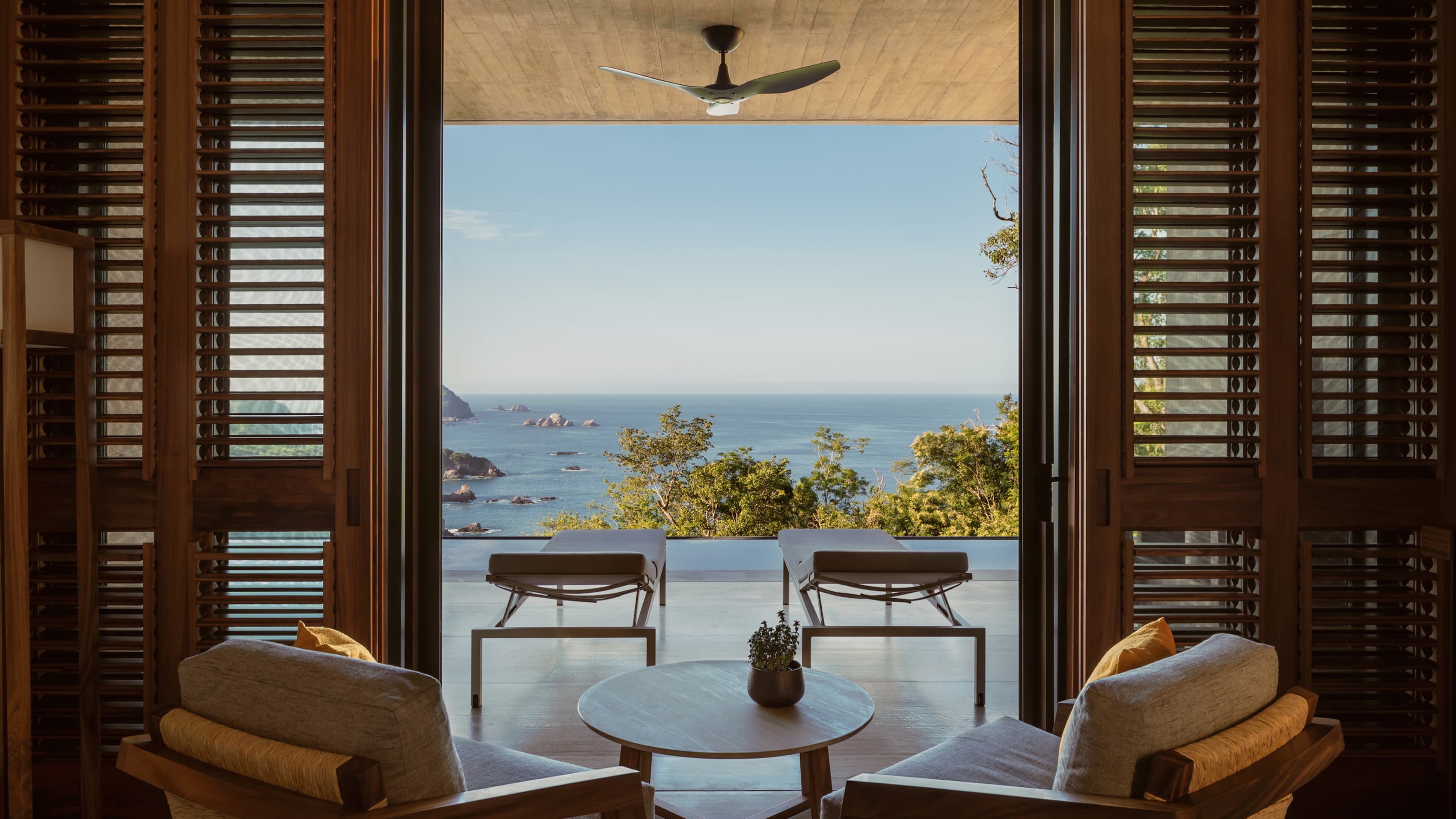 A quiet luxury resort pool at golden hour
